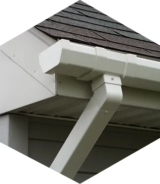 White rain gutter on house roof corner.