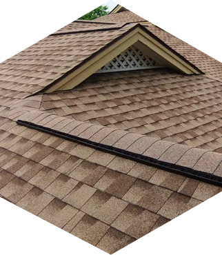 Close-up of shingled roof with dormer window