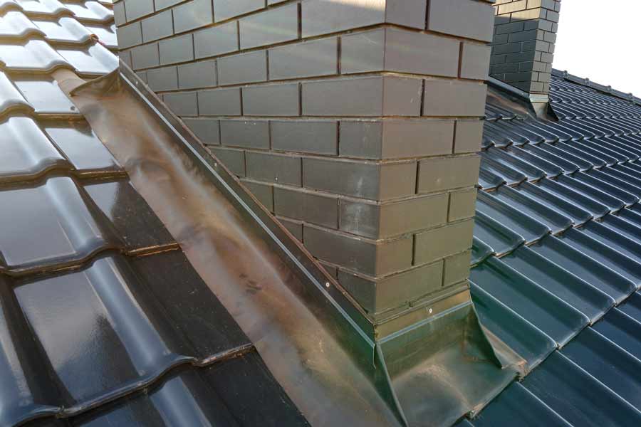 Metal roof flashing near chimney.