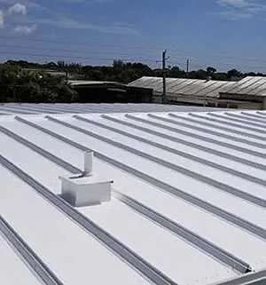 White corrugated metal roof with vent