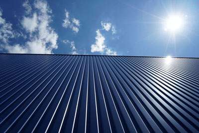 Sunlit modern building facade with vertical lines