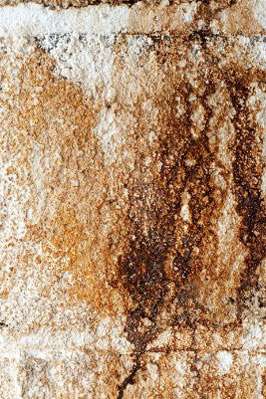 Close-up of weathered stone wall texture